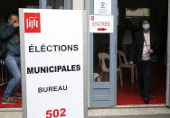 Current socialist Lille mayor and candidate in the second round of the municipal elections, Martine Aubry exits a polling booth before casting her vote, Sunday, June 28, 2020 in Lille, northern France. France is holding the second round of municipal elections in 5,000 towns and cities Sunday that were postponed due to the country's coronavirus outbreak.(AP Photo/Michel Spingler)