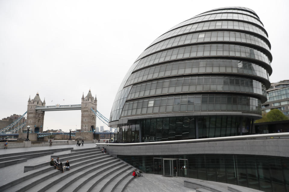 A view of Tower Bridge and City Hall on the South Bank of the River Thames in London, Wednesday, April 28, 2021. Brexit and the coronavirus pandemic have hit London in a perfect storm. In 2021, the city has less people, fewer businesses, starker divisions and tougher choices than anyone could have expected. On May 6, Londoners will elect a mayor, whose performance will help determine whether this is the start of a period of decline for Europe's biggest city — or a chance to do things better. (AP Photo/Alastair Grant)