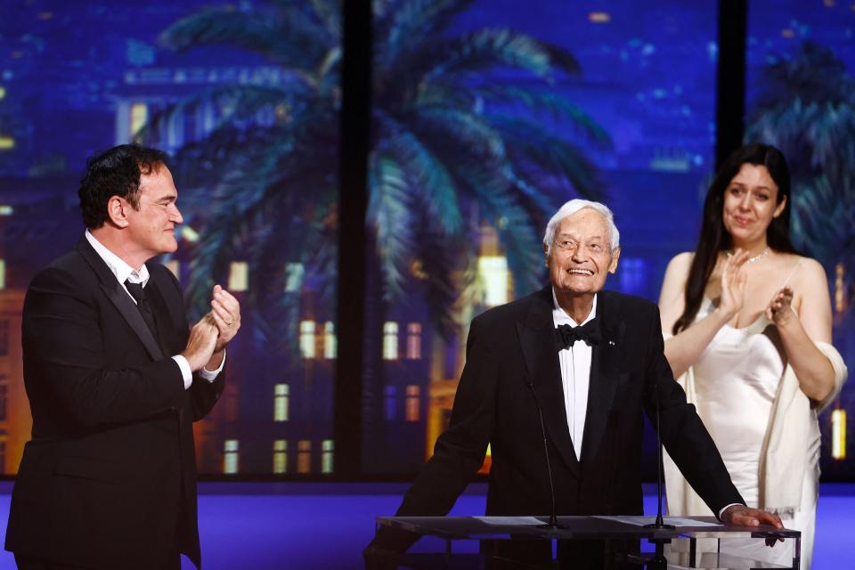 Director Quentin Tarantino applauds filmmaker Roger Corman during the closing ceremony of the 76th Cannes Film Festival in Cannes, France, May 27, 2023.