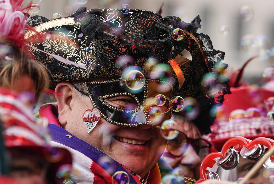 Revellers celebrate at the traditional Alter Markt the start of the street carnival in Cologne, Germany, Thursday, Feb. 16, 2023. Hundreds of thousands will celebrate the carnival without any coronavirus restrictions in the streets of the German carnival capital. (AP Photo/Martin Meissner)