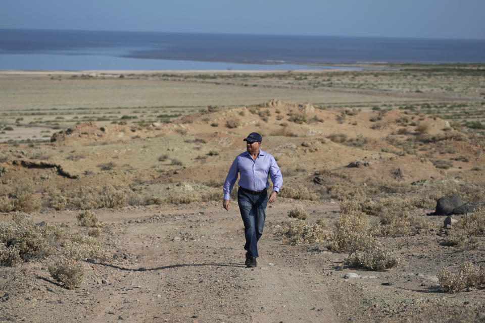 Rod Colwell, CEO of Controlled Thermal Resources, walks on the company's property, which will be mined for lithium, in Niland, Calif., near the shores of the Salton Sea, Thursday, July 15, 2021. Demand for electric vehicles has shifted investments into high gear to extract lithium from geothermal wastewater around the shrinking body of water. The ultralight metal is critical to rechargeable batteries. (AP Photo/Marcio Jose Sanchez)