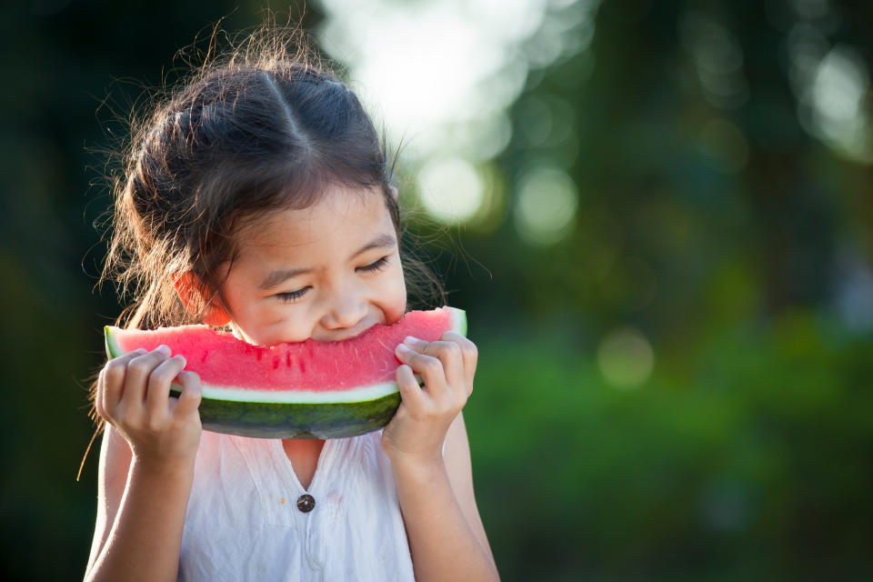 Little girl eating watermelon. (Getty Images)