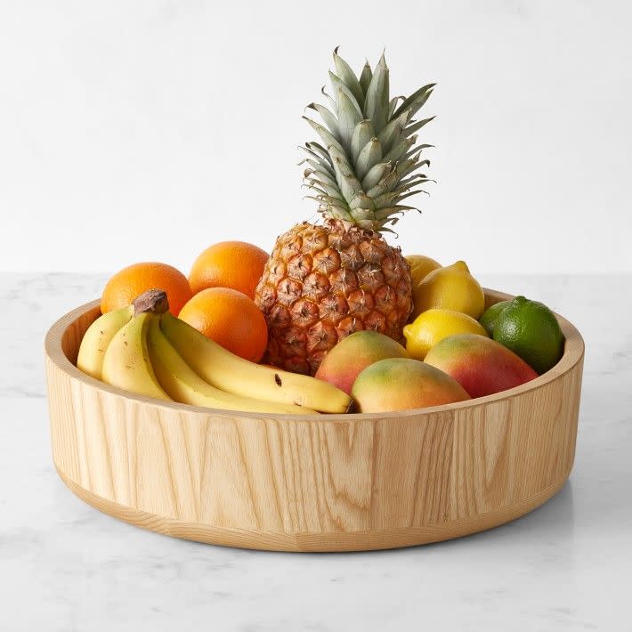 <p>Williams Sonoma</p><p><strong>$149.95</strong></p><p><a href="https://go.redirectingat.com?id=74968X1596630&url=https%3A%2F%2Fwww.williams-sonoma.com%2Fproducts%2Fhold-everything-fruit-bowl-flat-bottom&sref=https%3A%2F%2Fwww.delish.com%2Fkitchen-tools%2Fcookware-reviews%2Fg40026294%2Fbest-fruit-bowls%2F" rel="nofollow noopener" target="_blank" data-ylk="slk:Shop Now;elm:context_link;itc:0;sec:content-canvas" class="link ">Shop Now</a></p><p>With a 16-inch diameter, the <strong><a href="https://go.redirectingat.com?id=74968X1596630&url=https%3A%2F%2Fwww.williams-sonoma.com%2Fproducts%2Fhold-everything-fruit-bowl-flat-bottom%2F&sref=https%3A%2F%2Fwww.delish.com%2Fkitchen-tools%2Fcookware-reviews%2Fg40026294%2Fbest-fruit-bowls%2F" rel="nofollow noopener" target="_blank" data-ylk="slk:Williams Sonoma Hold Everything Large Fruit Bowl;elm:context_link;itc:0;sec:content-canvas" class="link ">Williams Sonoma Hold Everything Large Fruit Bowl</a> </strong>does just that—it holds <em>everything</em>. It's made of sustainably-sourced, FSC-certified ash wood, which is known for its durability. To clean it, simply wipe it down with a wet cloth.</p>