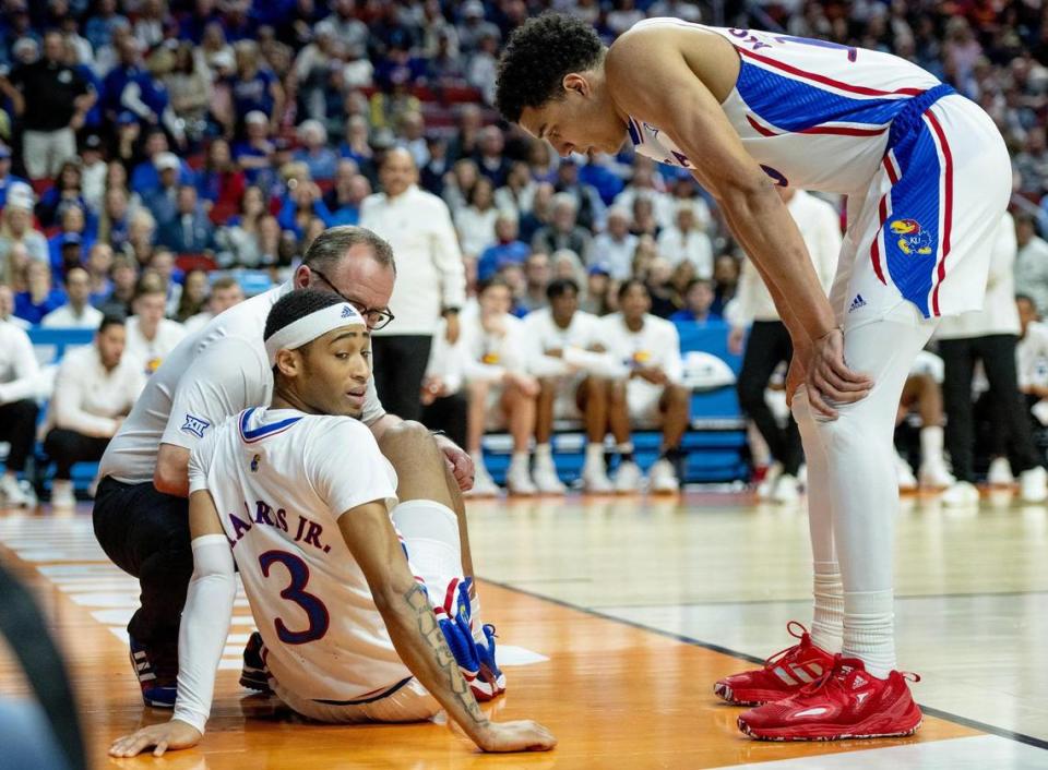 Kansas guard Dajuan Harris Jr. (3) looks back at a photographer he landed on during a second-round college basketball game against Arkansas in the NCAA Tournament Saturday, March 18, 2023, in Des Moines, Iowa.