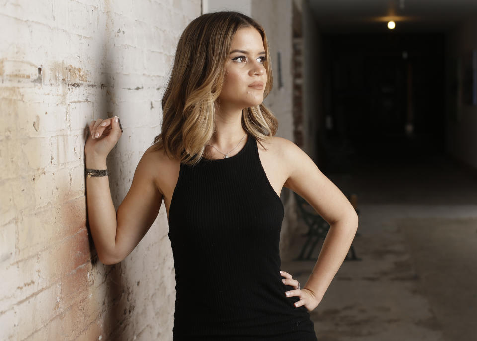 FILE - In this May 31, 2016, file photo, singer Maren Morris poses in Nashville, Tenn. Morris is nominated in both country, pop and all-genre categories this year, including two nominations in the country genre categories for “Dear Hate,” a duet with Vince Gill released after the Las Vegas mass shooting, and a nomination for “Mona Lisas and Mad Hatters,” a cover from an Elton John tribute album. Her song "The Middle" with EDM artists Zedd and Grey, is nominated for record and song of the year at this year’s Grammy Awards on Feb. 10, and Morris was also nominated for best pop duo/group collaboration. (AP Photo/Mark Humphrey, File)