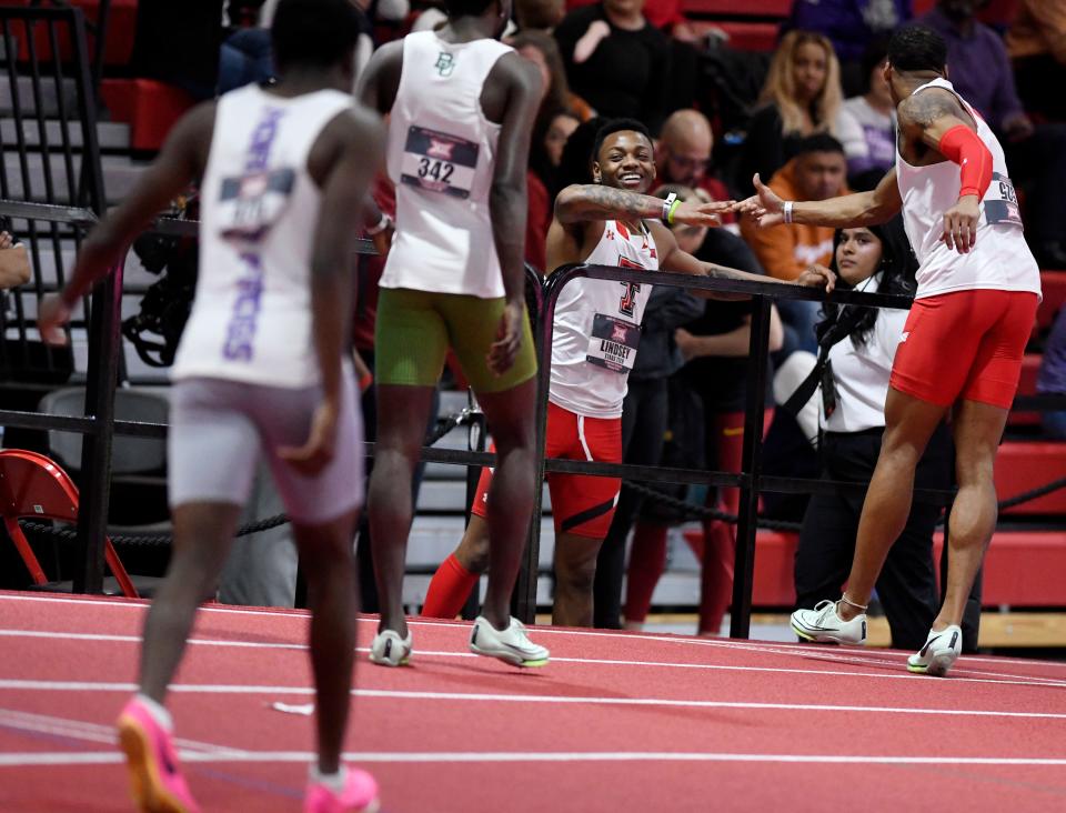 Texas Tech sprinters Courtney Lindsey, center, and Caleb Dean, right, congratulate each other during the Big 12 indoor track and field championships two weeks ago. Lindsey is ranked No. 1 in the 200 meters and Dean No. 2 in the 60-meter hurdles going into the NCAA indoor championships Friday and Saturday in Albuquerque, New Mexico.