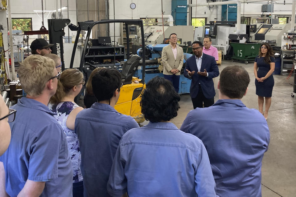 Republican candidate for Illinois governor Richard Irvin speaks with employees during a tour of HM Manufacturing Inc. in Wauconda, Ill., June 21, 2022. Irvin is seeking the Republican nomination to face Democratic Gov. J.B. Pritzker in November. (AP Photo/Sara Burnett)