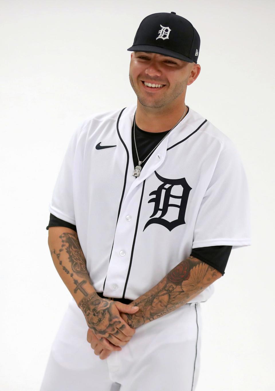 Detroit Tigers catcher Donny Sands poses during picture day at Spring Training Sunday, February 19, 2023.  Sands has summarized his life story in tattoos and has dealt with the loss of friends and family his moms name and the date his dad passed away tatted on his arms along with rosary hanging over a skull with the word Blessed are some of the tattoos he has.