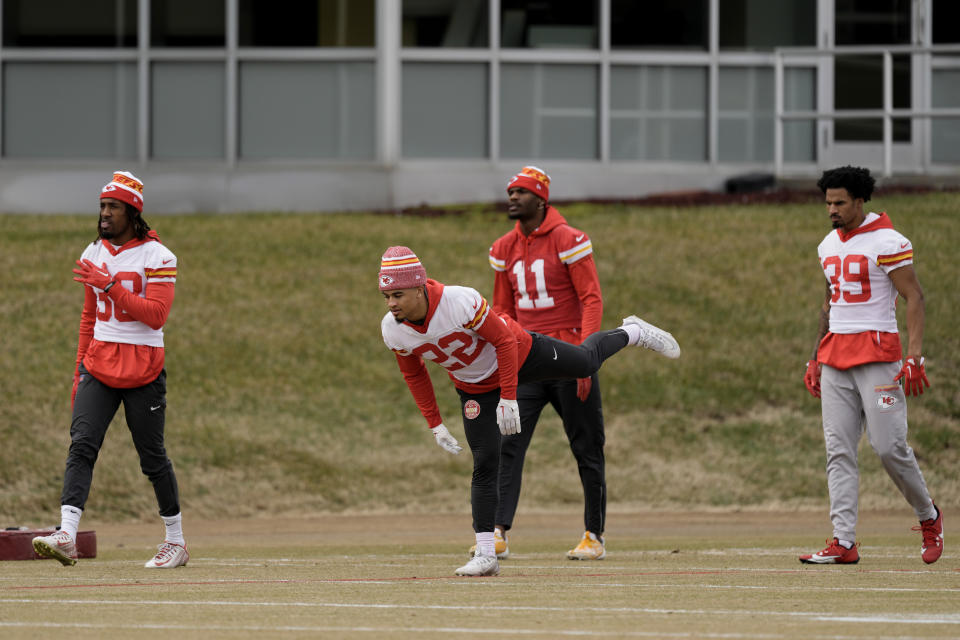 Kansas City Chiefs linebacker Nick Bolton, left, cornerback Trent McDuffie (22), wide receiver Marquez Valdes-Scantling (11) and cornerback Keith Taylor Jr. (39) stretch during the team's NFL football practice Thursday, Feb. 1, 2024 in Kansas City, Mo. The Chiefs will play the San Francisco 49ers in Super Bowl 58. (AP Photo/Charlie Riedel)