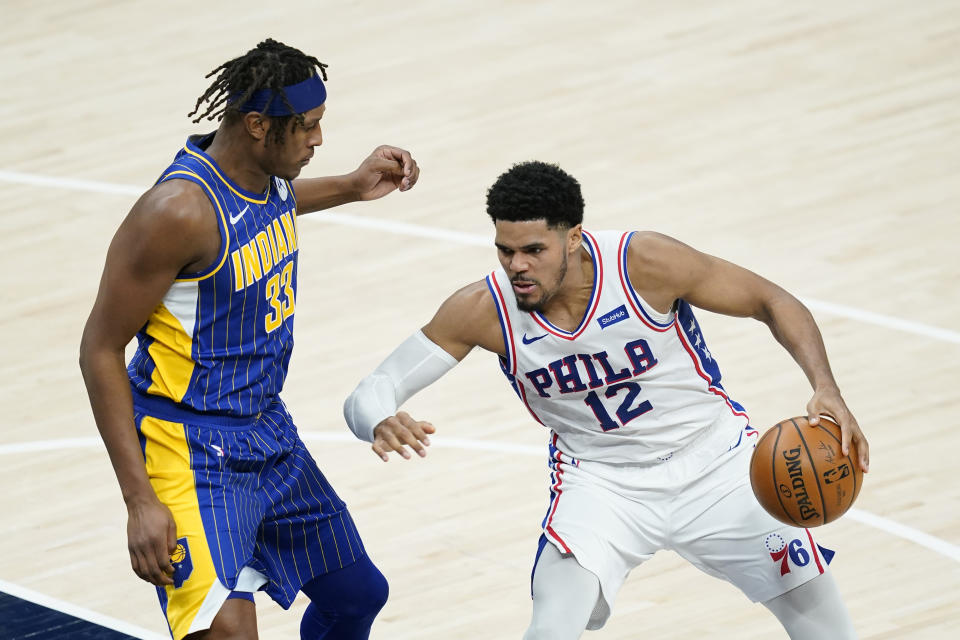 Philadelphia 76ers' Tobias Harris (12) is defended by Indiana Pacers' Myles Turner (33) during the second half of an NBA basketball game, Sunday, Jan. 31, 2021, in Indianapolis. (AP Photo/Darron Cummings)