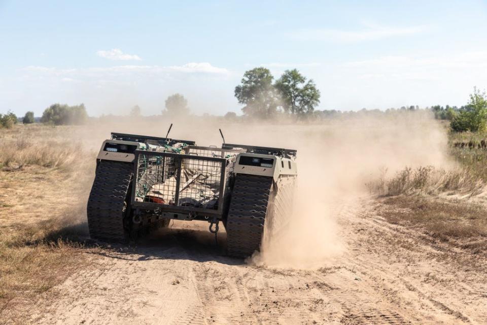 Evacuation robot (unmanned ground vehicle) THeMIS seen on a dusty road during the field tests in Kyiv, Ukraine.