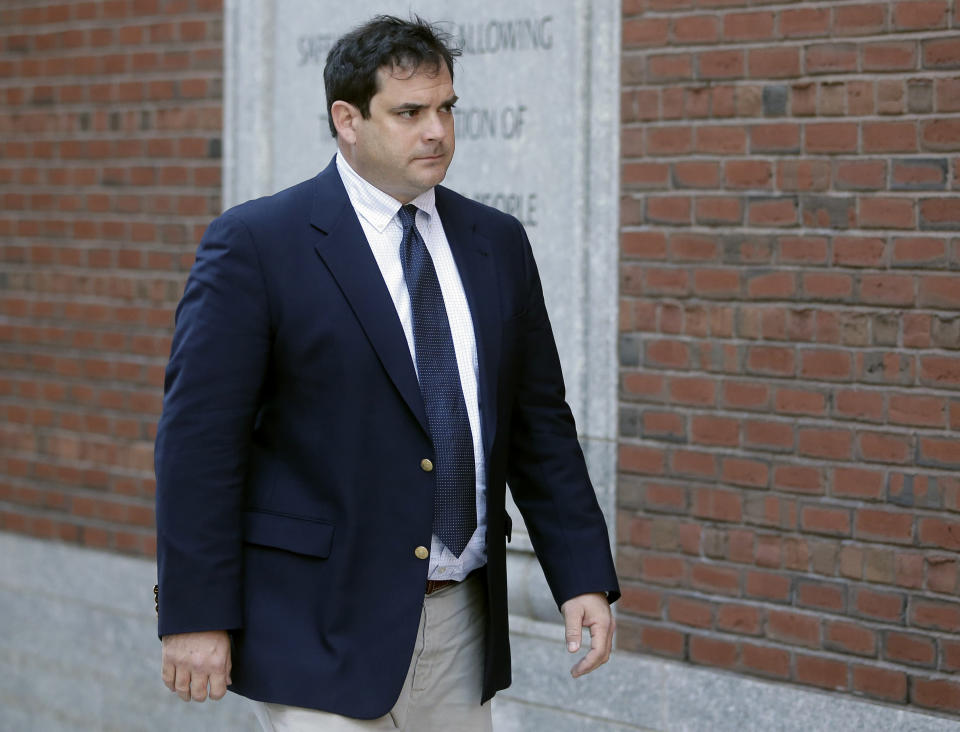 FILE - In this March 12, 2019 file photo, John Vandemoer, former head sailing coach at Stanford, arrives at federal court in Boston to plead guilty to charges in a nationwide college admissions bribery scandal. A total of 50 people have been charged, including 33 parents, 10 coaches and college athletics officials, and seven others. (AP Photo/Steven Senne, File)