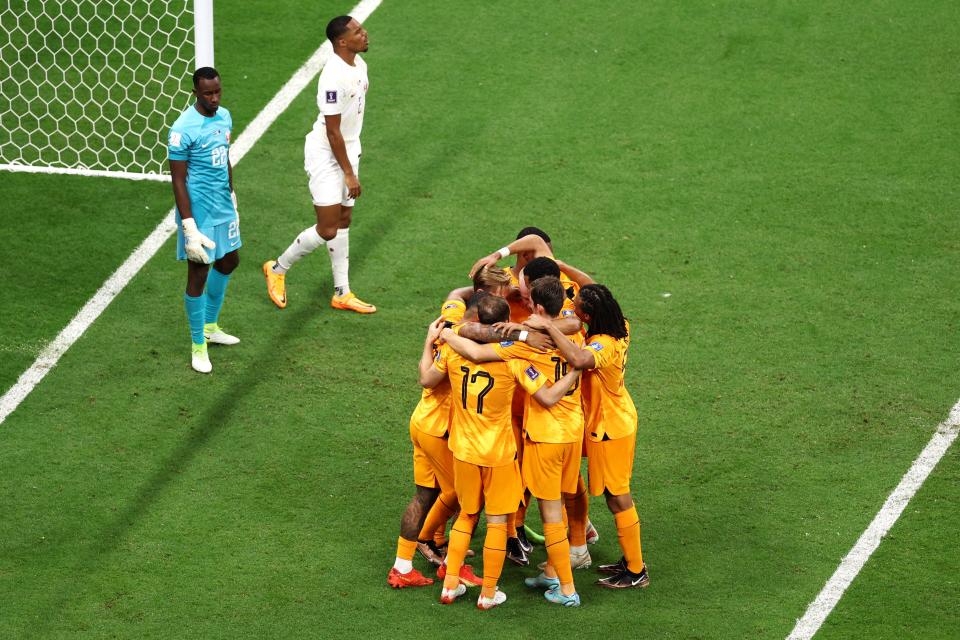 The Dutch celebrate their second goal against Qatar (Getty Images)