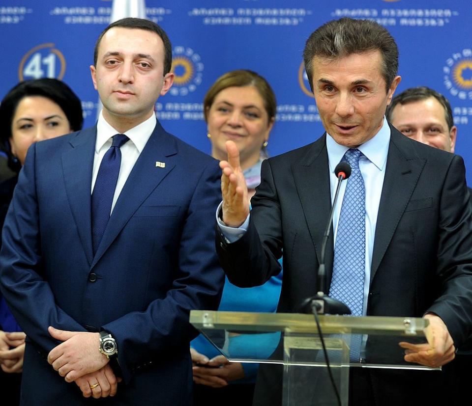 Georgian Prime Minister Irakli Garibashvili (R) and his predecessor, oligarch Bidzina Ivanishvili at a press conference in Tbilisi on Nov. 2, 2013. Both are members of Georgian Dream. (Vano Shlamov/AFP via Getty Images)