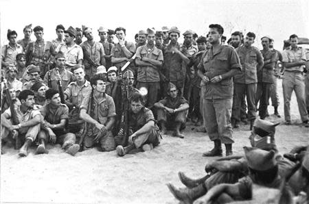 Ariel Sharon (R) briefs his army unit before an operation in this handout file picture taken August 30, 1955 and released by Israel's Defence Ministry. REUTERS/Israel's Defence Ministry/Handout/Files