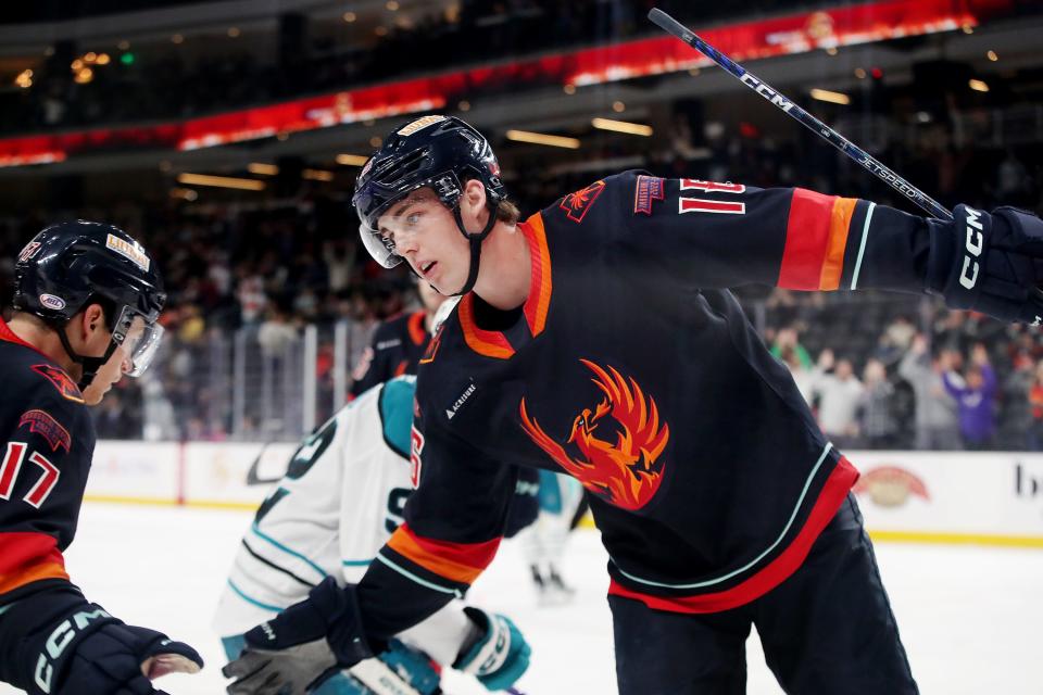 Coachella Valley Firebirds' Kole Lind (16) celebrates a goal in the second period against the San Jose Barracuda at Acrisure Arena in Palm Desert, Calif., on Monday, April 3, 2023.