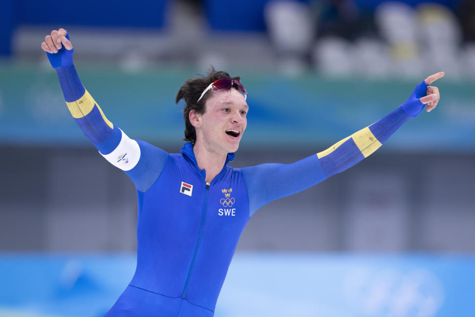 Nils van der Poel, of Sweden, reacts after winning the gold medal in the men's 5,000-meter speedskating race at the 2022 Winter Olympics in Beijing on Sunday, Feb. 6, 2022. (Paul Chiasson/The Canadian Press via AP)