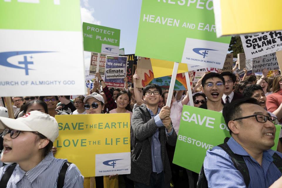 A large crowd of protesters hold up signs during Climate Strike at the Domain in Sydney (Getty Images)