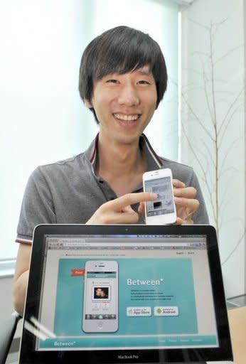 Park Jae-Uk, whose VCNC company runs the smartphone app "Between", displays the app on an iPhone. "Facebook and Twitter may do a good job in connecting people in all sorts of ways, but we thought maybe some people want a closed and private relationship," said Park