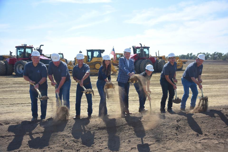 South Dakota Soybean Processors CEO Tom Kersting, Gov. Kristi Noem and other project partners throw dirt during the groundbreaking ceremony for High Plains Processing, LLC's $500 million crush plant south of Mitchell on Tuesday, Sept. 19, 2023.