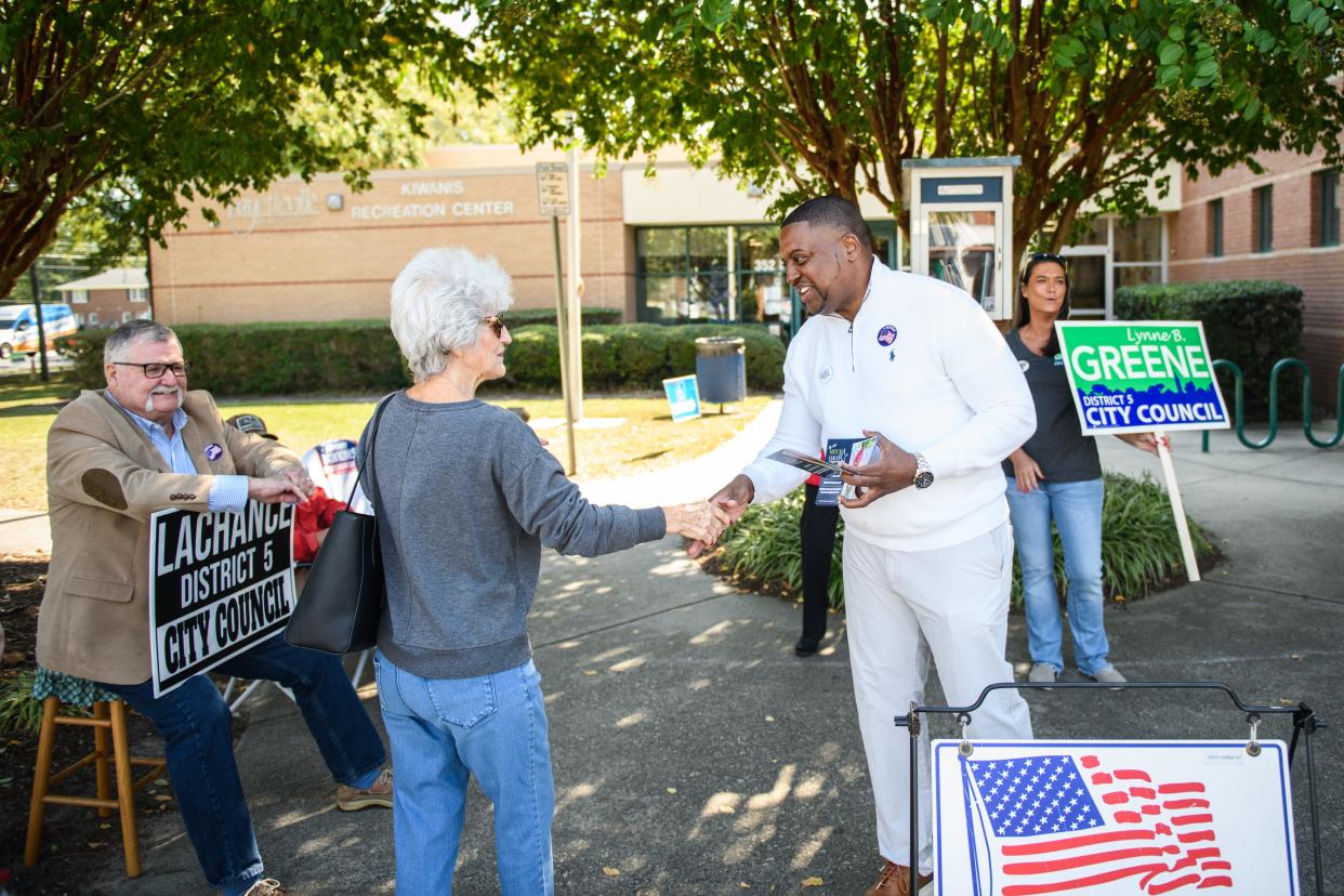 Mayor Mitch Colvin speaks to voters as they go into the Kiwanis Recreation Center to vote on Tuesday, Oct. 10, 2023.