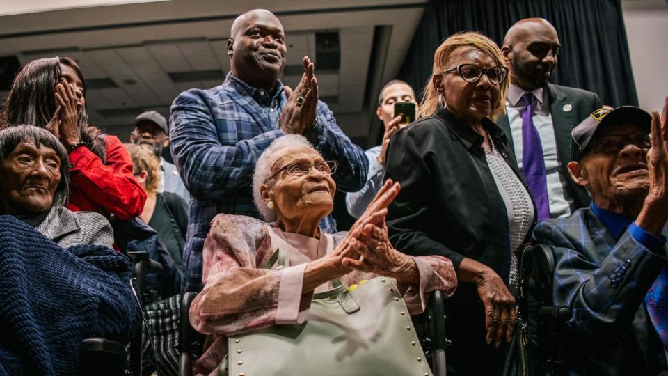 PHOTO: Survivors Lessie Benningfield Randle, Viola Fletcher, and Hughes Van Ellis sing together at the conclusion of a rally during commemorations of the 100th anniversary of the Tulsa Race Massacre on June 1, 2021, in Tulsa, Oklahoma. (Brandon Bell/Getty Images)