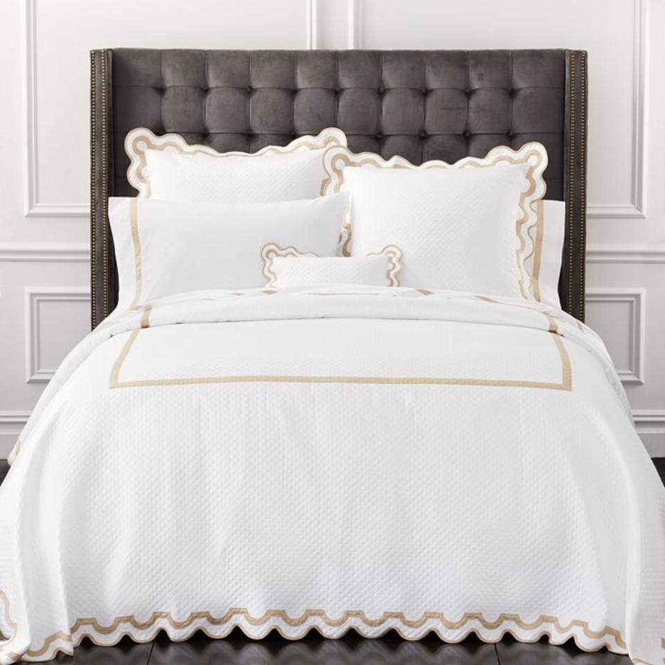 Matouk Mirasol Matelasse Bedding Collection on a bed.