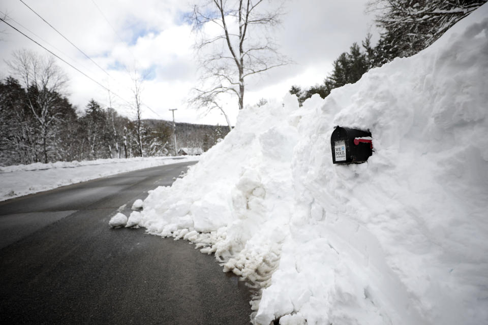 A mailbox on Old Route 9 in Windsor, Mass., is barely visible on Wednesday, March 15, 2023, after being dug out the day after snow storm. (Stephanie Zollshan/The Berkshire Eagle via AP)