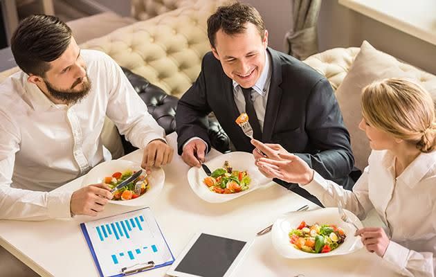 Eating lunch at work helps boost brain productivity. Source: Getty