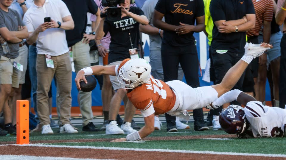 Texas quarterback Arch Manning dives toward the goalline during the second half. - Michael Thomas/AP