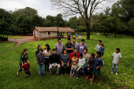 Community leader Cornelia Flores (C) poses for a photograph with community members, in Isla Jovai Teju, Paraguay May 9, 2019. REUTERS/Jorge Adorno