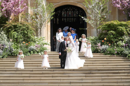 Lady Gabriella Windsor and Thomas Kingston kiss on the steps outside St George's Chapel after their wedding, in Windsor Castle, near London, Britain May 18, 2019. Chris Jackson/Pool via REUTERS