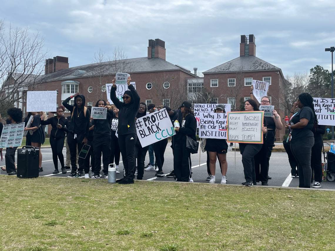 Coastal Carolina University students dressed in black are protesting the Trump rally on Saturday, Feb. 10, 2024. The students said they are upset because the university didn’t give students advanced notice of the rally.