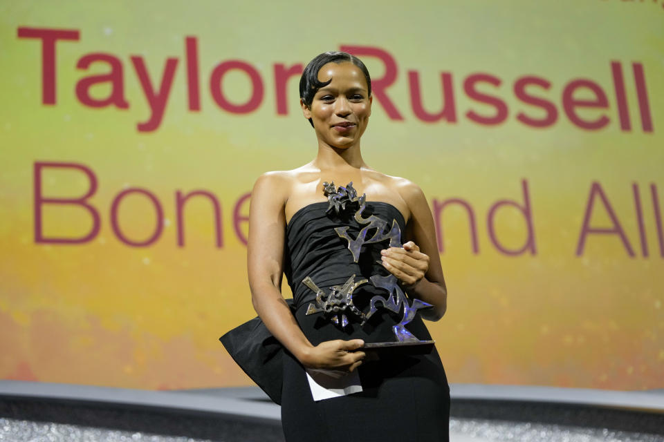 Taylor Russell holds the Marcello Mastroianni award for best young actress for the film 'Bones and All' at the closing ceremony of the 79th edition of the Venice Film Festival in Venice, Italy, Saturday, Sept. 10, 2022. (AP Photo/Domenico Stinellis)