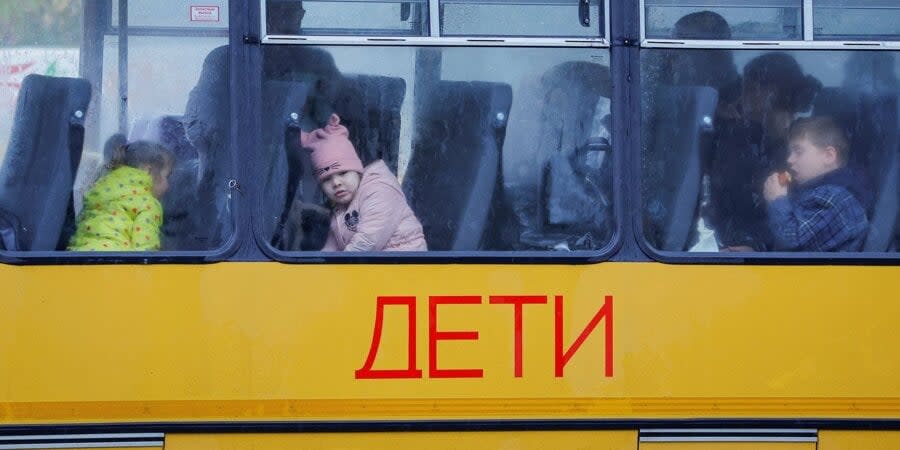 A bus with children leaves from the occupied city of Oleshka, Kherson Oblast, to Crimea, October 2022