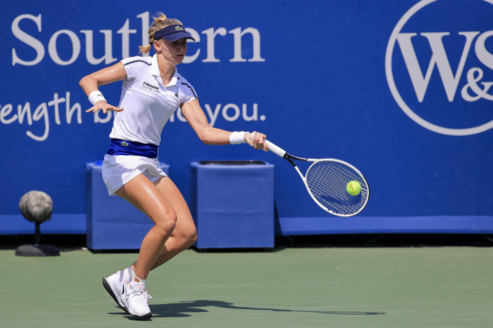 Jil Teichmann, of Switzerland, returns to Ashleigh Barty, of Australia, during the women's single final of the Western & Southern Open tennis tournament Sunday, Aug. 22, 2021, in Mason, Ohio. (AP Photo/Aaron Doster)