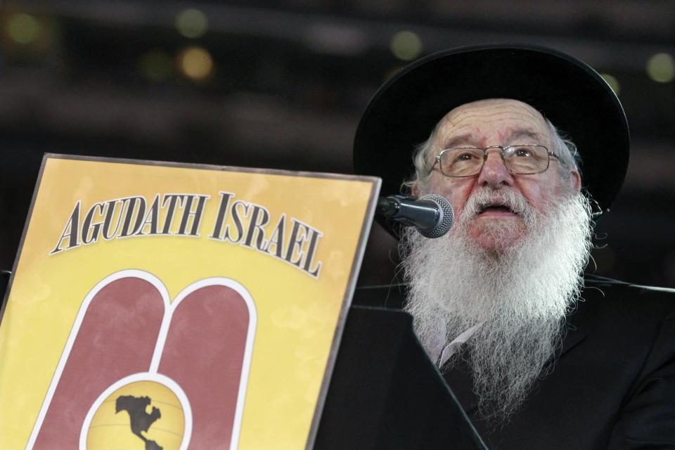 Rabbi Yaakov Perlow addresses a large crowd of Orthodox Jews at MetLife stadium in East Rutherford, N.J, Wednesday, Aug. 1, 2012, during the celebration Siyum HaShas. The Siyum HaShas, marks the completion of the Daf Yomi, or daily reading and study of one page of the 2,711 page book. The cycle takes about 7½ years to finish.This is the 12th put on by Agudath Israel of America, an Orthodox Jewish organization based in New York. Organizers say this year's will be, by far, the largest one yet. More than 90,000 tickets have been sold, and faithful will gather at about 100 locations worldwide to watch the celebration. (AP Photo/Mel Evans)