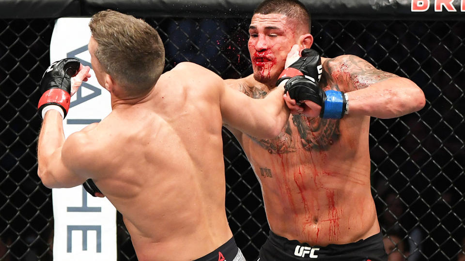 Anthony Pettis punches Stephen Thompson in their welterweight bout during the UFC Fight Night event at Bridgestone Arena on March 23, 2019 in Nashville, Tennessee. (Photo by Jeff Bottari/Zuffa LLC/Zuffa LLC via Getty Images)