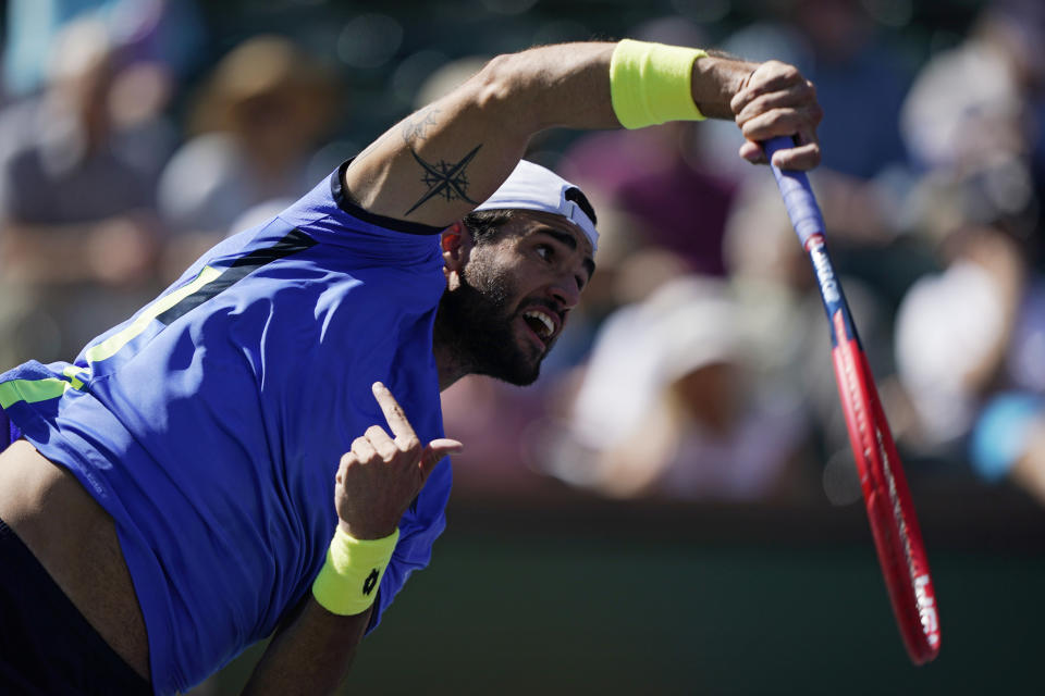 Matteo Berrettini, of Italy, serves to Taylor Fritz at the BNP Paribas Open tennis tournament Tuesday, Oct. 12, 2021, in Indian Wells, Calif. (AP Photo/Mark J. Terrill)