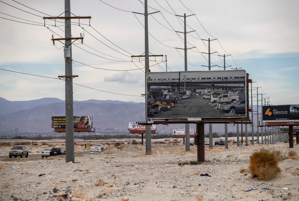 A billboard featuring a photograph by Thomas Broening depicting the housing crisis is seen along Gene Autry Trail in Palm Springs, Calif., Saturday, Aug. 13, 2022. 