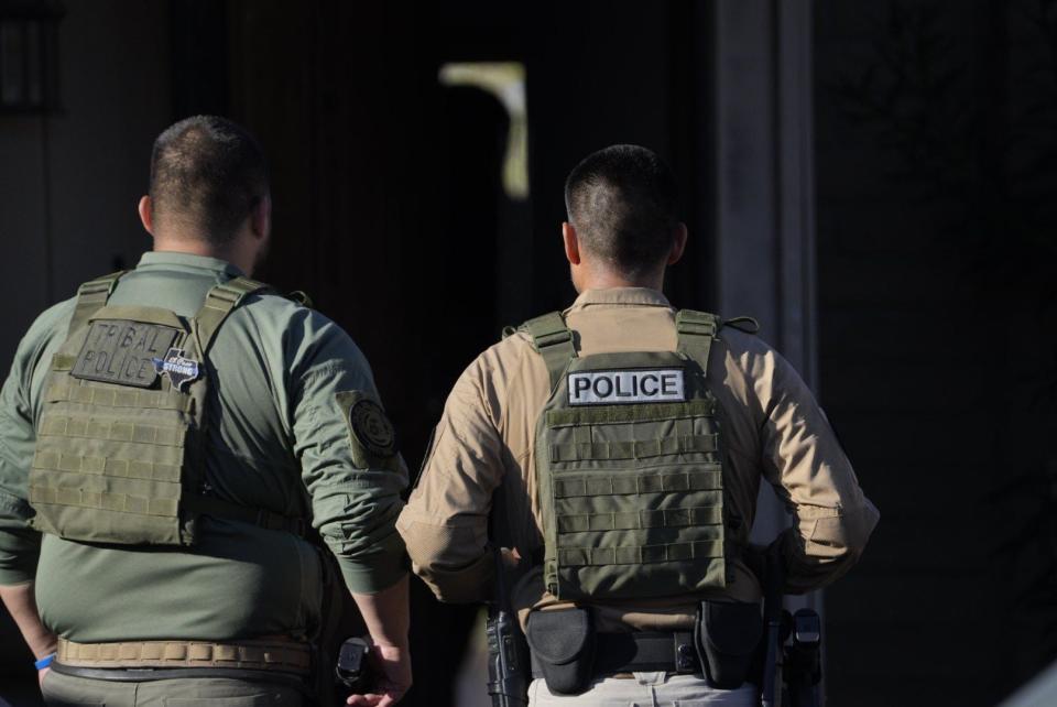 FBI El Paso agents and other law enforcement officers enter a home Thursday, Aug. 29, 2024, as part of raids targeting Chuco Tango gang members at several locations throughout El Paso.