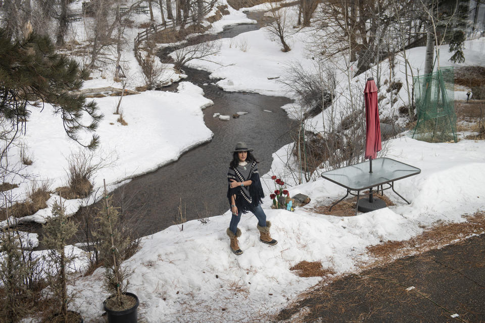 Taralyn Romero stands in front of Bear Creek, behind her home, on Feb. 9, 2023 in Kittredge, Colorado.