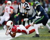 <p>Wide receiver Larry Fitzgerald #11 of the Arizona Cardinals makes a catch against cornerback Byron Maxwell #41 of the Seattle Seahawks in the first half at CenturyLink Field on December 31, 2017 in Seattle, Washington. (Photo by Jonathan Ferrey/Getty Images) </p>