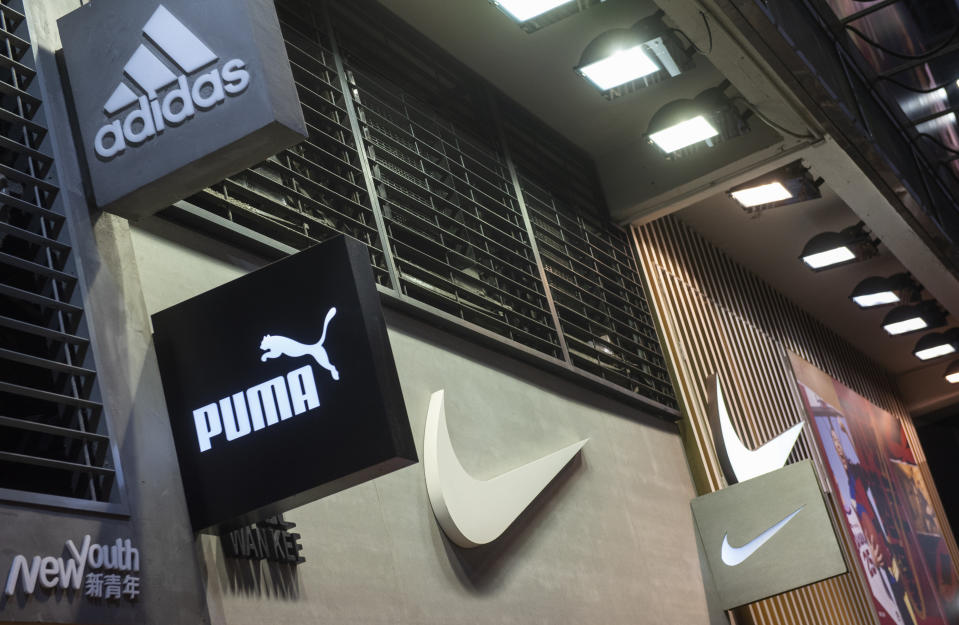 HONG KONG, CHINA - 2020/01/31: Multinational sport clothing brands Adidas, Puma and Nike logos seen at a store in Hong Kong. (Photo by Budrul Chukrut/SOPA Images/LightRocket via Getty Images)