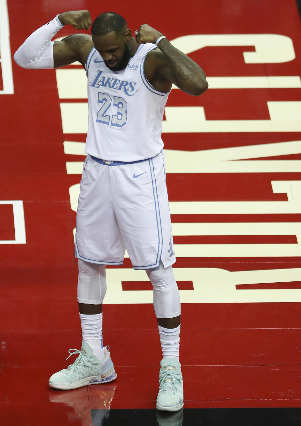 Los Angeles Lakers forward LeBron James (23) reacts after scoring on a drive to the basket against the Houston Rockets during the first quarter of an NBA basketball game on Sunday, Jan. 10, 2021, at Toyota Center in Houston. (Brett Coomer/Houston Chronicle via AP)