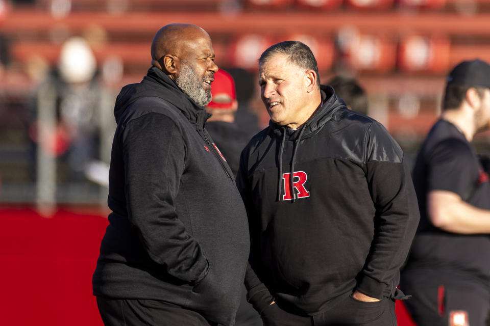 Maryland head coach Michael Locksley, left, speaks with Rutgers head coach Greg Schiano before an NCAA college football game, Saturday, Nov. 25, 2023, in Piscataway, N.J. (AP Photo/Corey Sipkin)