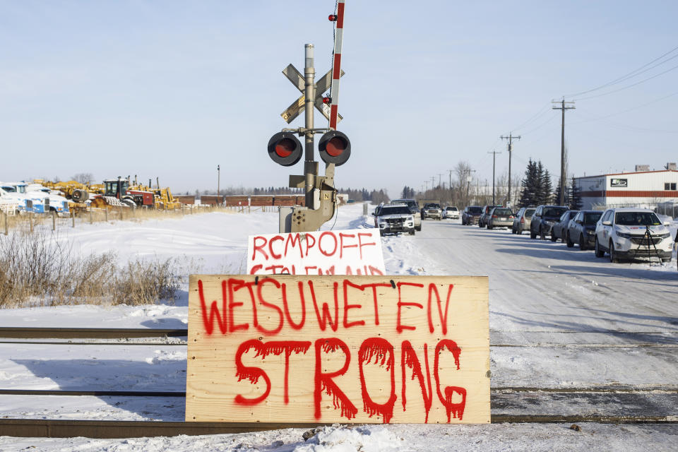 Supporters of the Wet'suwet'en who are against the LNG pipeline, block a Canadian National Railway line just west of Edmonton, Alberta, on Wednesday, Feb. 19, 2020. (Jason Franson/The Canadian Press via AP)