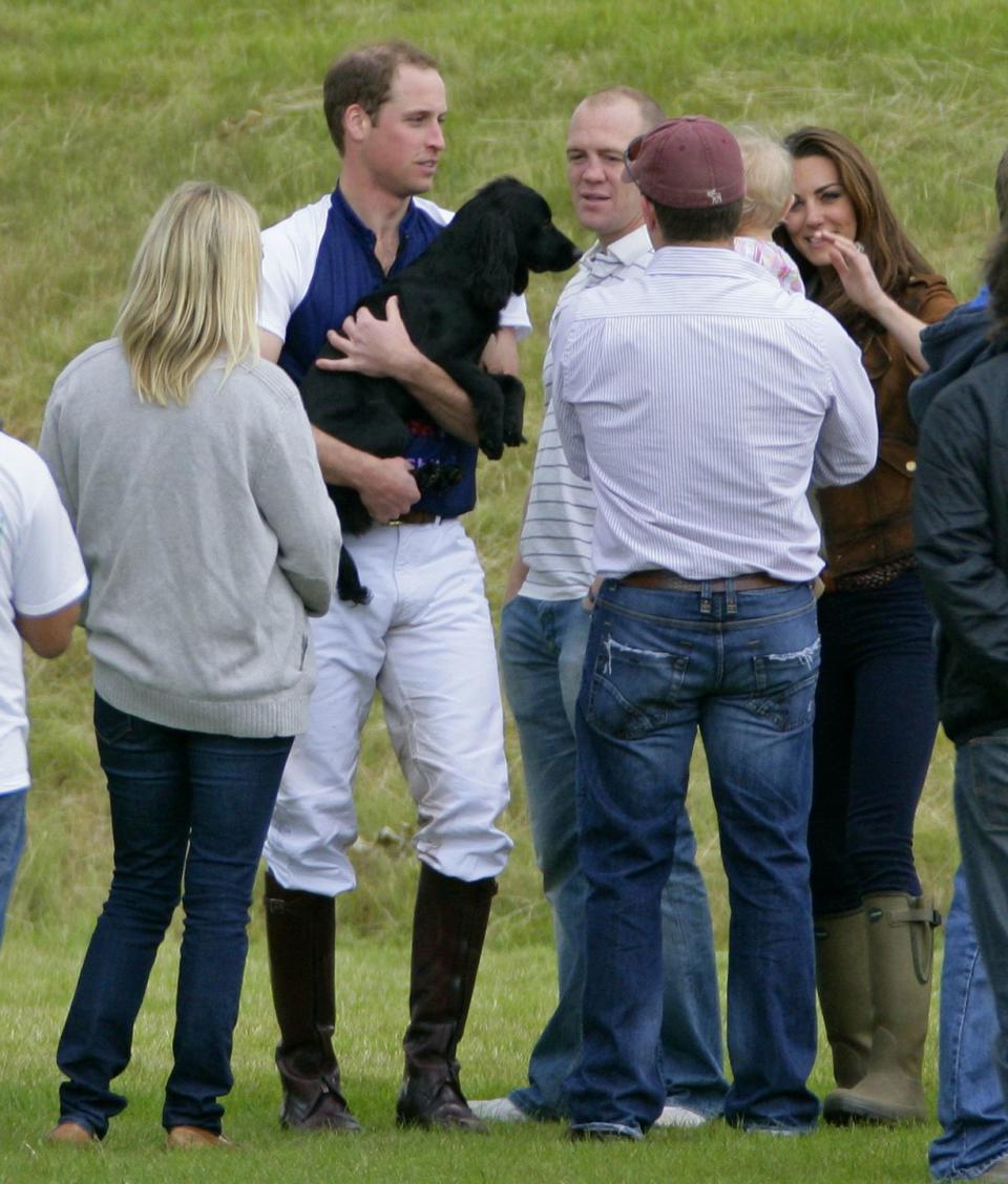 Prince William cuddling his dog