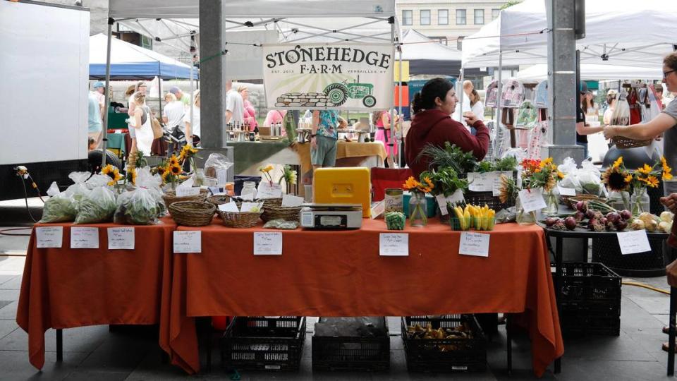 Daphne Hale sells produce, flowers and other goods from Stonehedge Farm on Saturday, June 17, 2023 at the Fifth Third Pavilion in downtown Lexington, Ky.