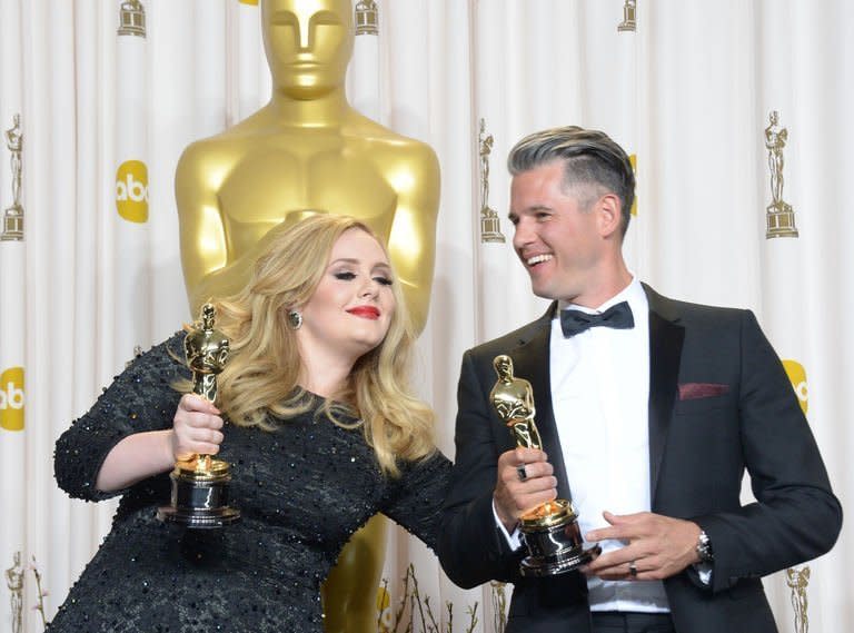 Adele Adkins and Paul Epworth hold the Best Original Song Award for "Skyfall" at the Academy Awards on February 24, 2013 in Hollywood, California. In a heavily musical show, Adele sang Oscar-winning 007 theme "Skyfall" and Shirley Bassey belted out "Goldfinger" to mark 50 years of Bond films, while Barbra Streisand sang "The Way We Were," her first Oscars turn for 36 years